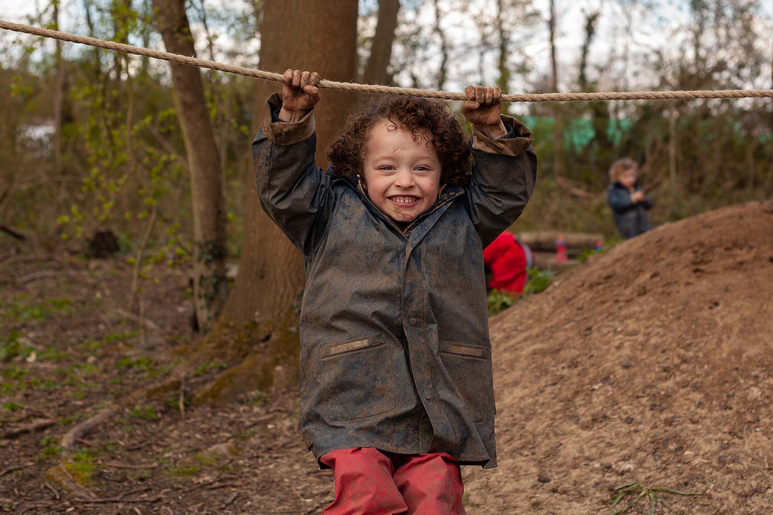 Boy playing in the forest