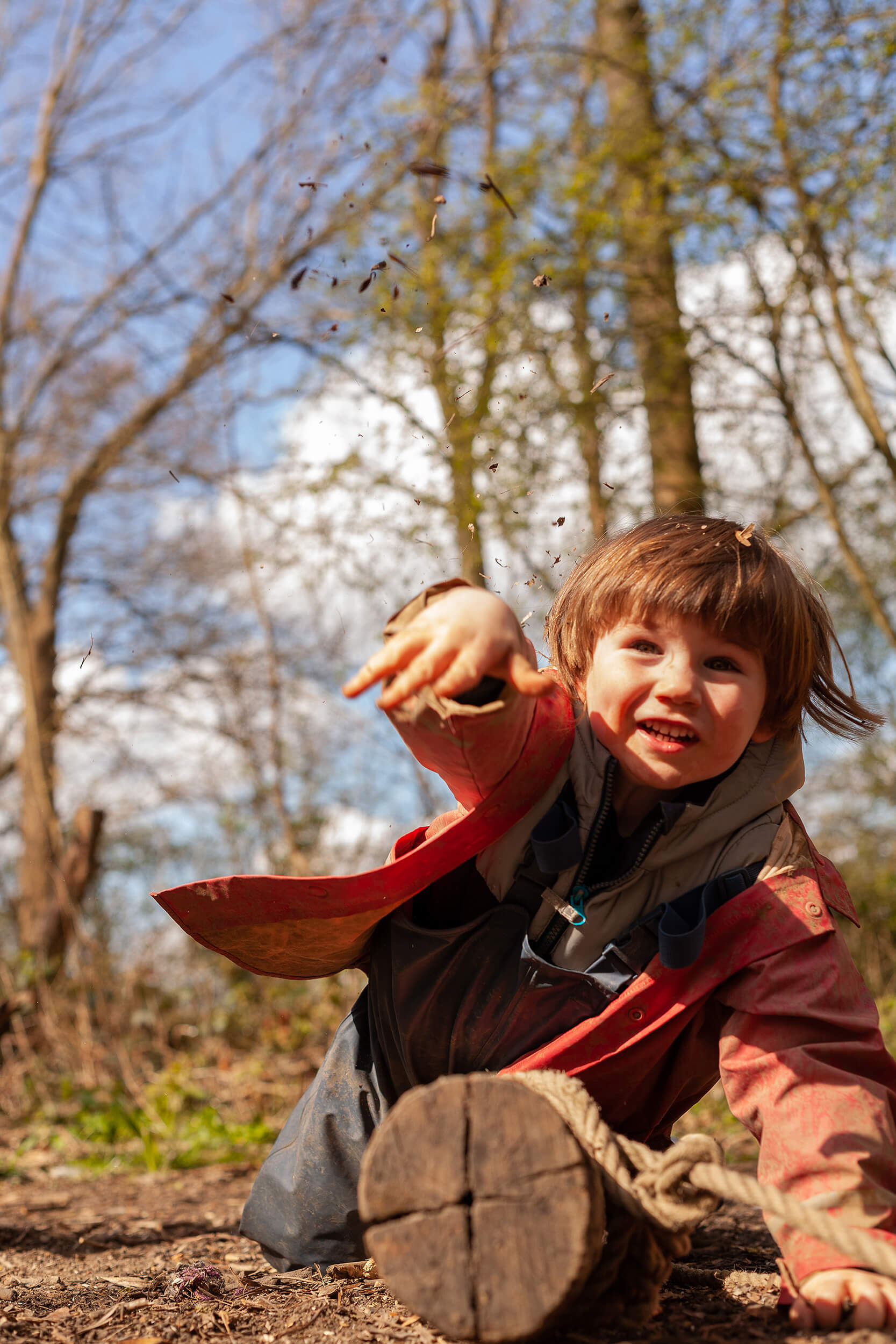 Boy throwing some bark