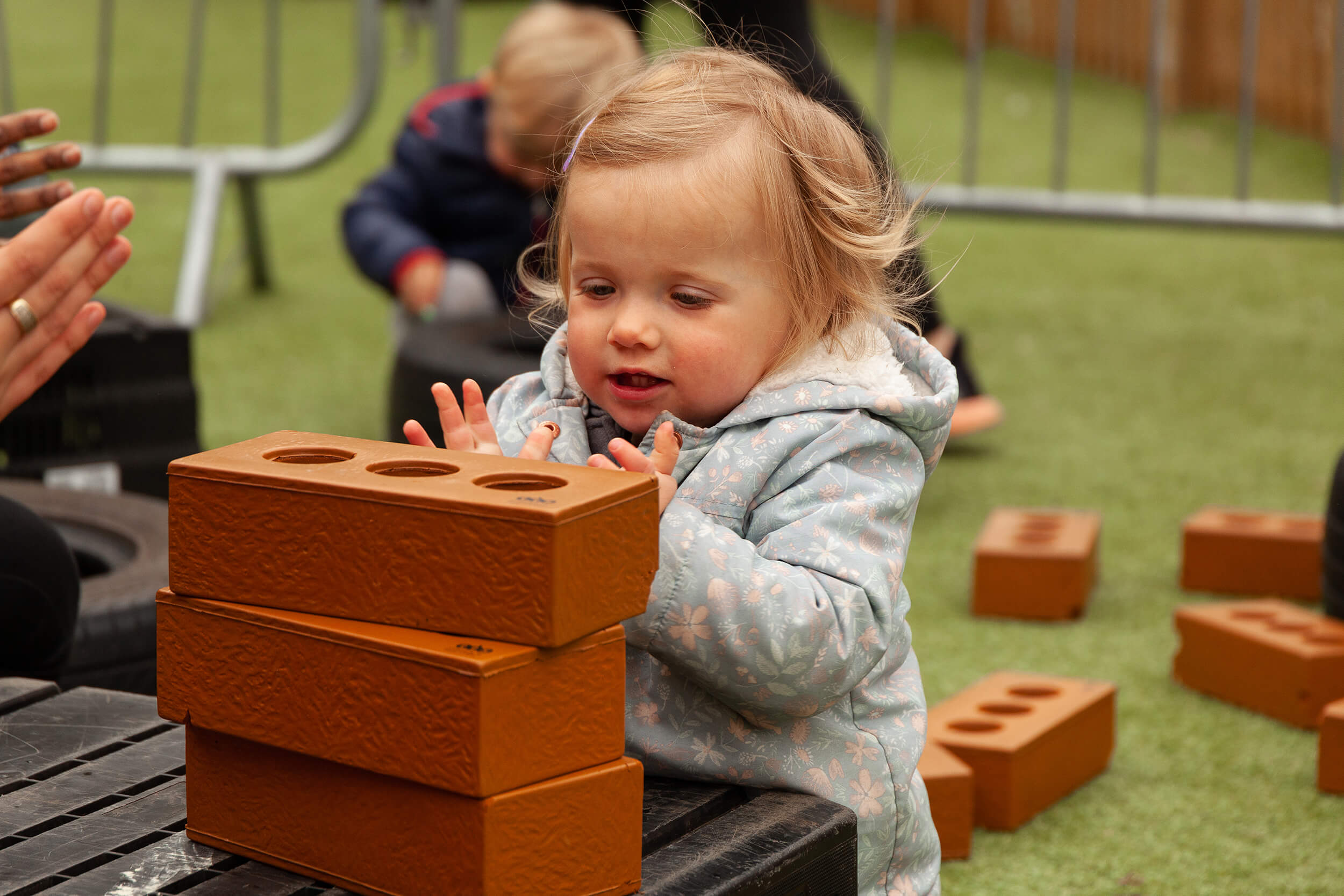 Girl playing with soft bricks