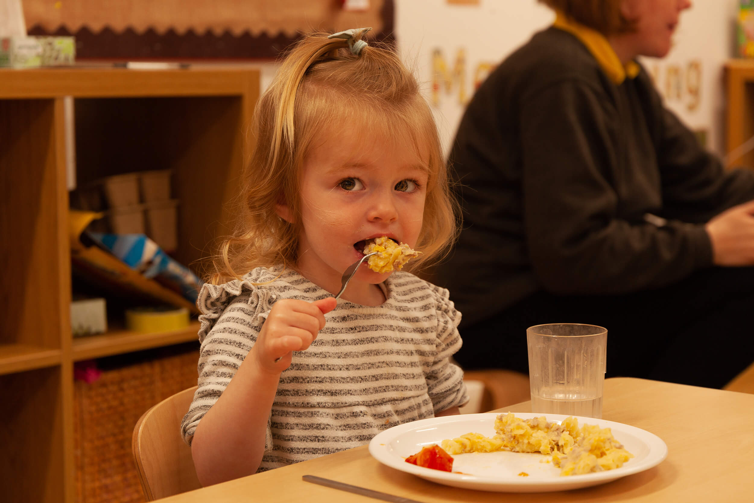 Girl eating at the table