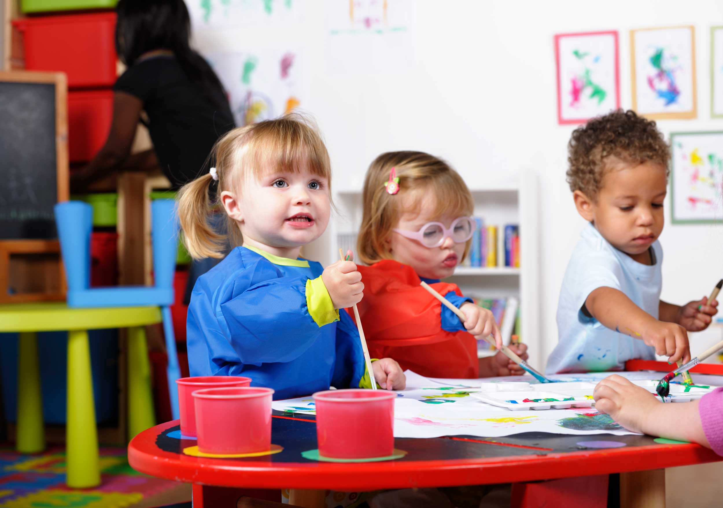 Kids painting at the table