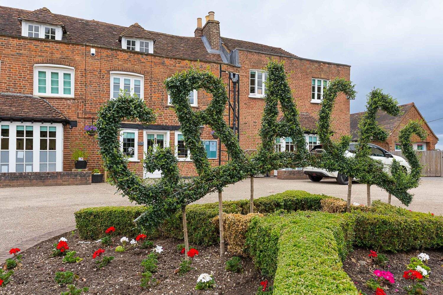 Grace's day nursery - Ruxley front of the building with bush carved into 