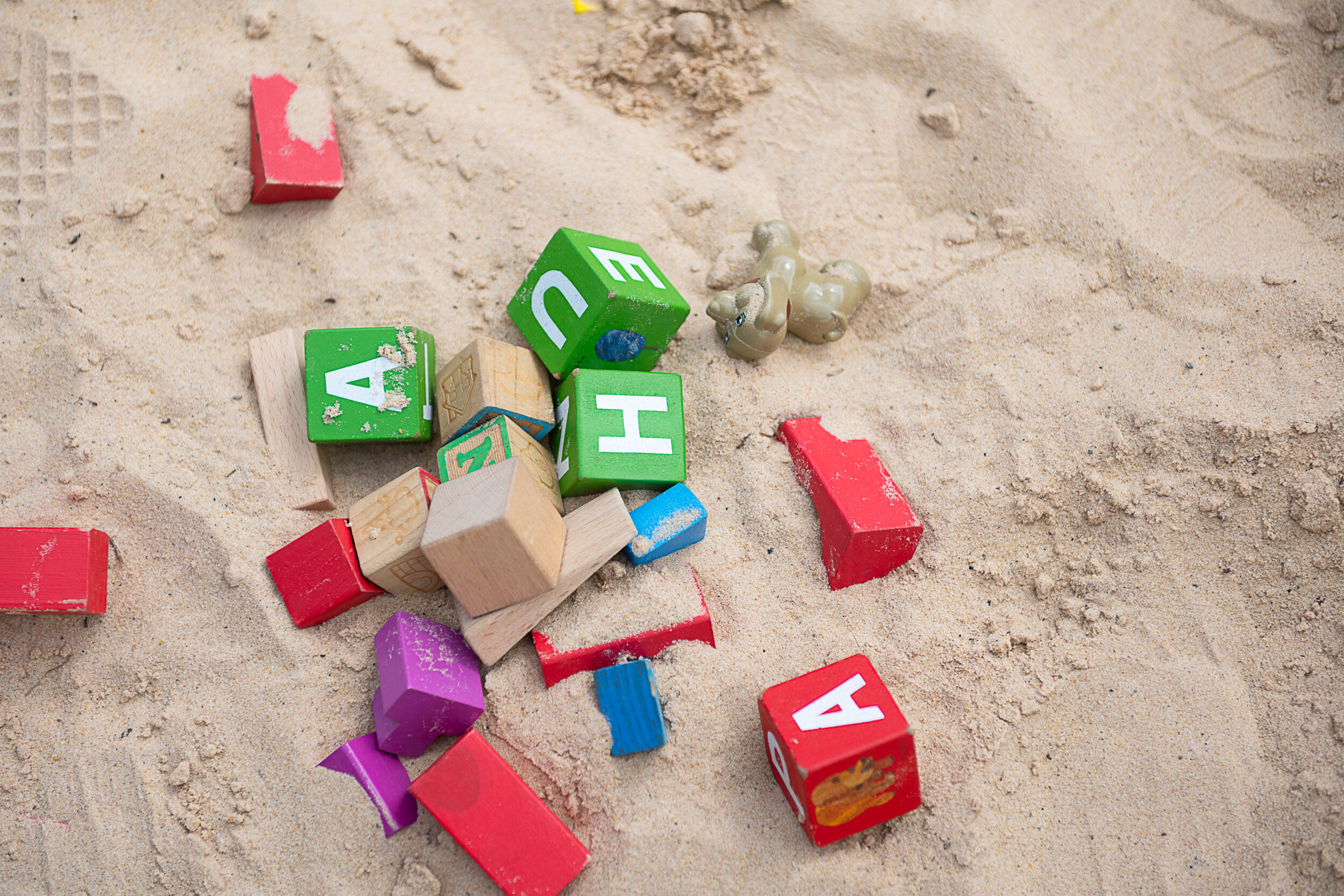 Childrens building blocks in sand