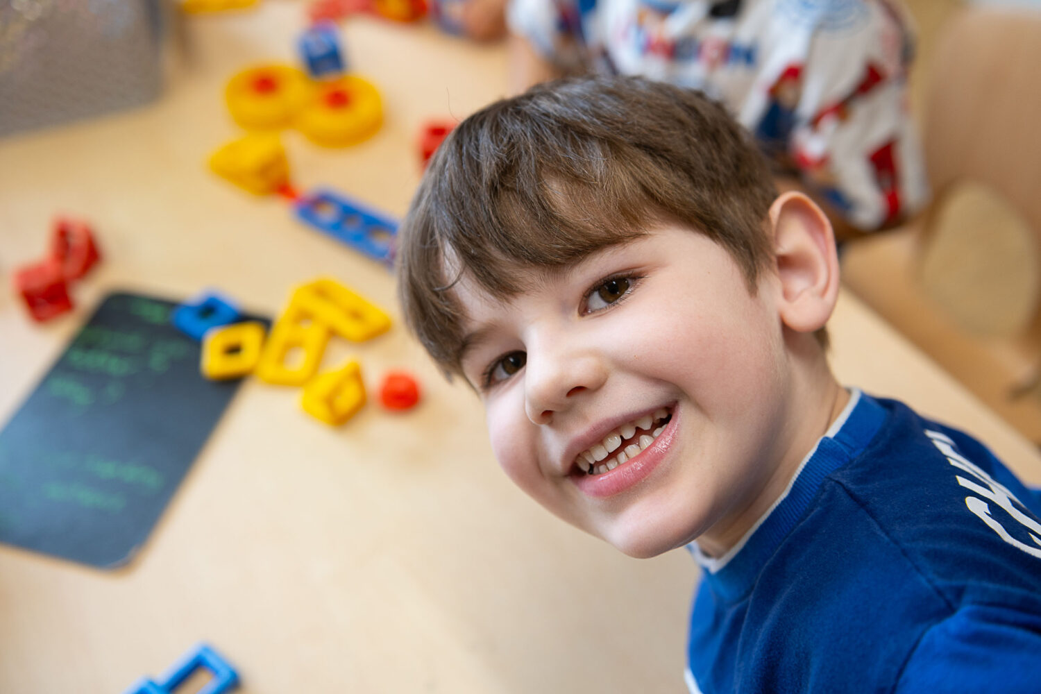 Young boy looking directly at the camera and smiling