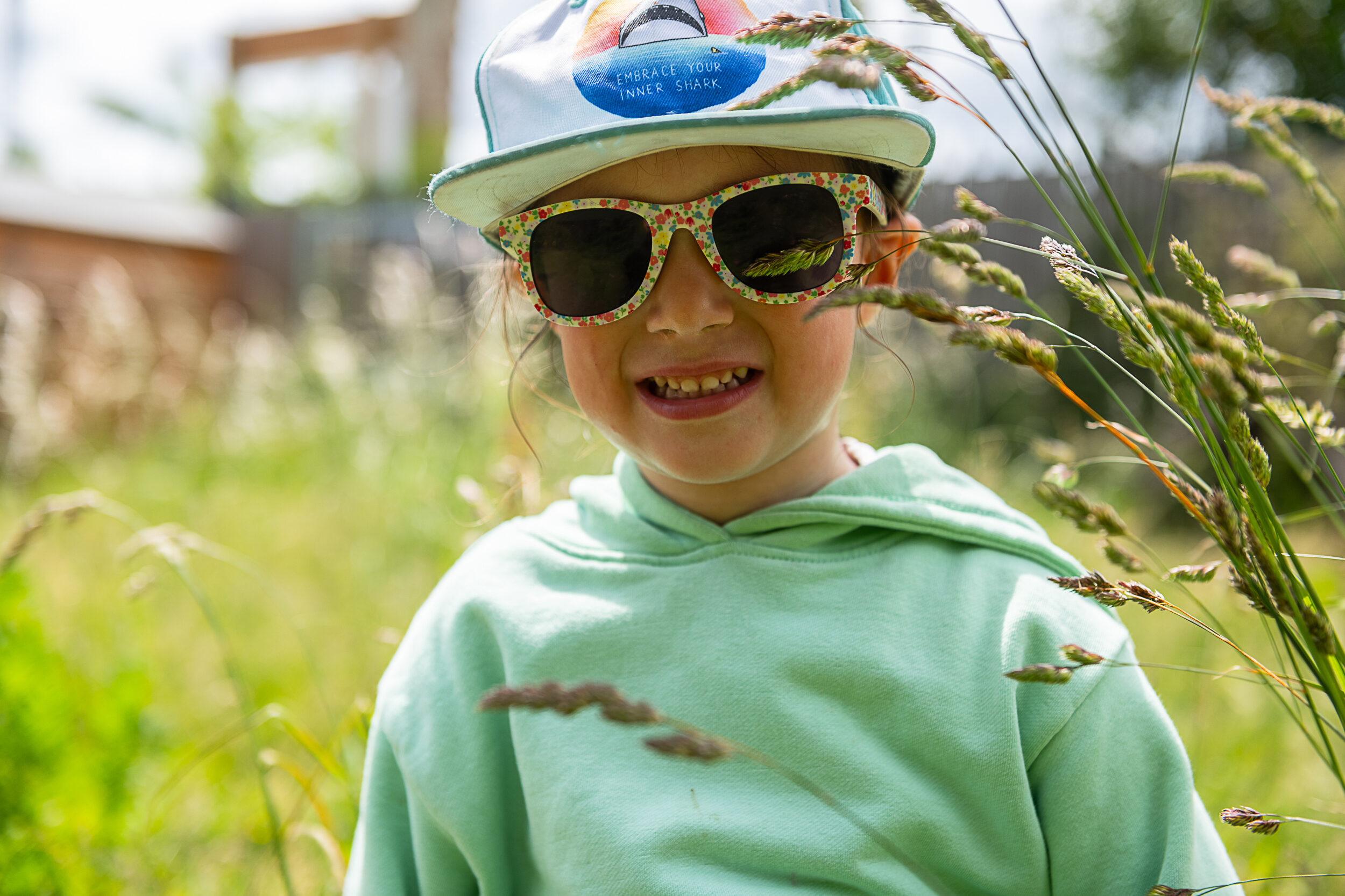 Graces day Nursery Young Girkl in Garden wearing Sunglasses